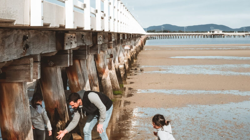 Family-on-the-beach-under-Long-Jetty-Port-Welshpool-1_346a849cd073025081fc2d8f697aa682