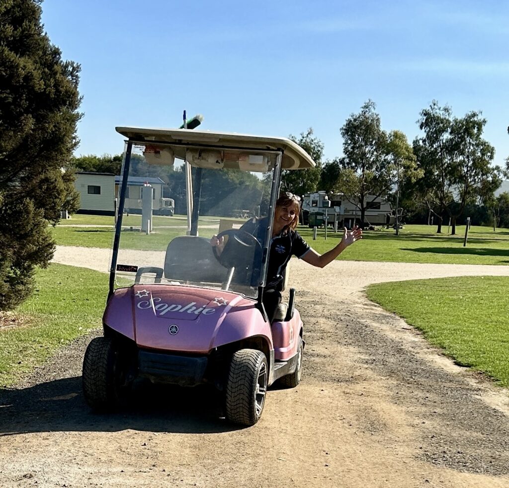 A woman drivinng a buggy cart at BIG4 Long Jetty Caravan Park