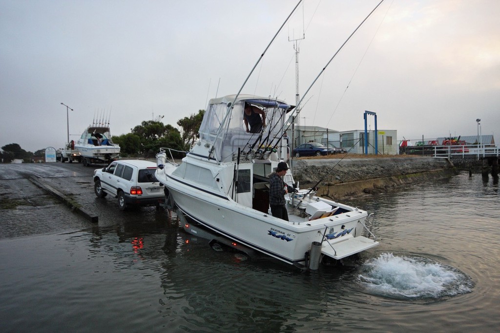 A boat entering the water at a boat ramp in Port Welshpool
